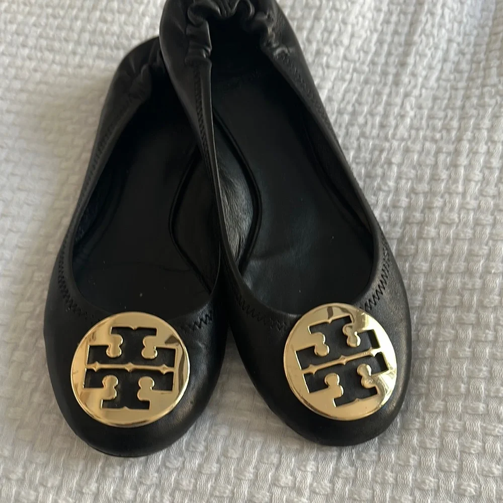 Tory Burch Black Flats with Gold Medallion - Picture 1 of 6